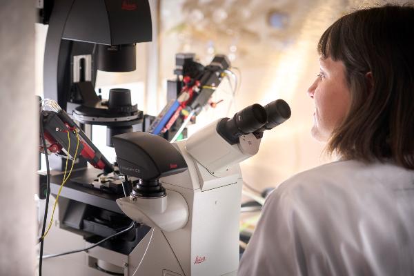 Researcher at patch clamp stand.