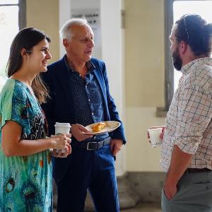 At the 2023 research forum: Anna Antonova and Helmut Trischler talking with Rob Gioielli.