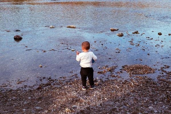 Child exploring the beach.