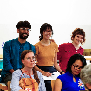 Three PhD students at the 2023 research forum.