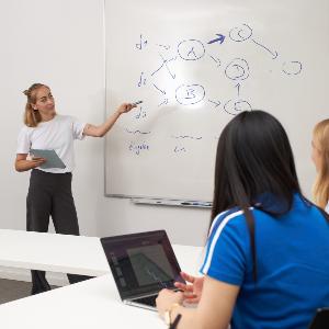 A lecturer explains a data processing model in the course