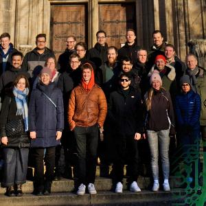 A photo of the group in front of the entrance of a church