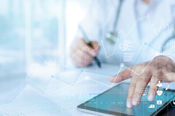 A hand using a stylus on a digital tablet, with a semi-transparent overlay of a molecular or medical-style diagram. | © iStock A hand using a stylus on a digital tablet, with a semi-transparent overlay of a molecular or medical-style diagram.