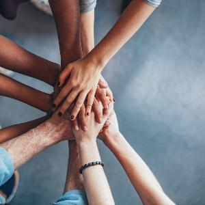 Several hands placed together in a gesture of teamwork and unity, symbolizing collaboration and joint research effortts | © Jacob Ammentorp Lund Several hands placed together in a gesture of teamwork and unity, symbolizing collaboration and joint research effortts