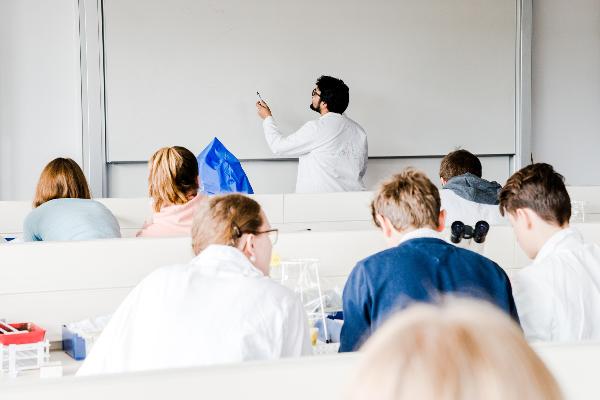 Lecturer and students in the lab