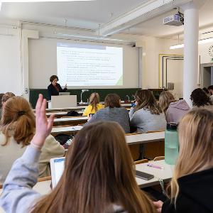 Lecture hall with lecturer and students