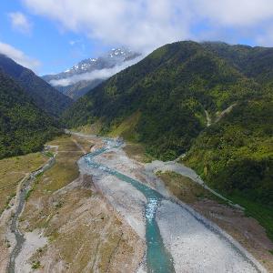 Poerua River, draining the Southern Alps of New Zealand. Landslide scars and debris flows result from the rapid erosion of the mountains. Their deposits are chemical-weathering hotspots.