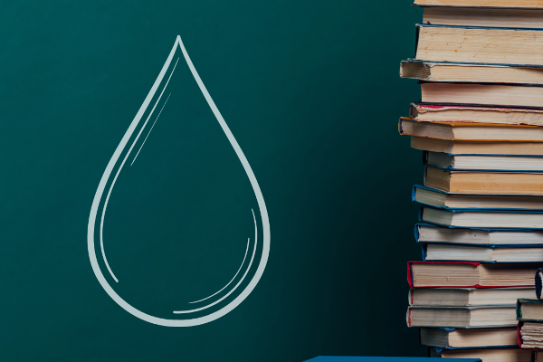 Stack of books with water drop overlay