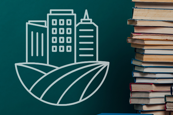 Bücherstapel mit Stadt-Grafik | © Canva | Lehrstuhl für Wirtschaftsgeographien der Zukunft Bücherstapel mit Stadt-Grafik