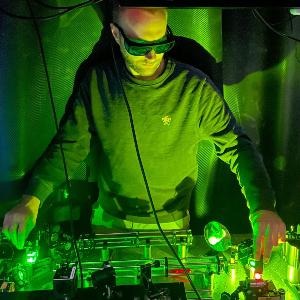 Researcher working at a laser setup