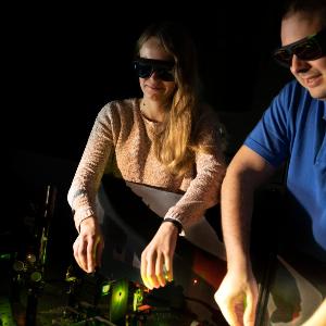 Fiona Cole and Jonas Zähringer, joint lead authors of the paper, calibrate a fluorescence microscope.