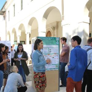 Researchers looking at posters at a CeNS workshop in Venice