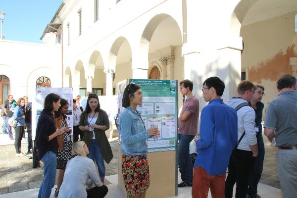 Researchers looking at posters at a CeNS workshop in Venice