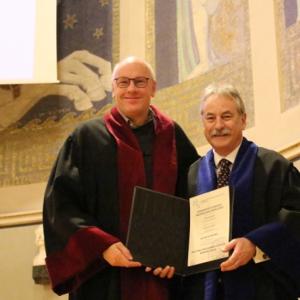 Prof. Alan Palmer being awarded the first GSN honorary doctorate in 2016