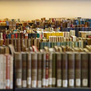 Rows of books on shelves in a library