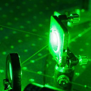 Close-up shot of an experimental setup with a laser in a laboratory