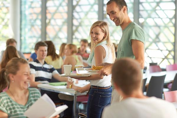 Students in conversation in the canteen