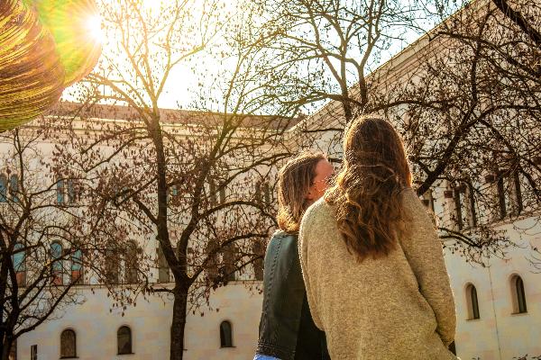 Two persons in conversation during sunset