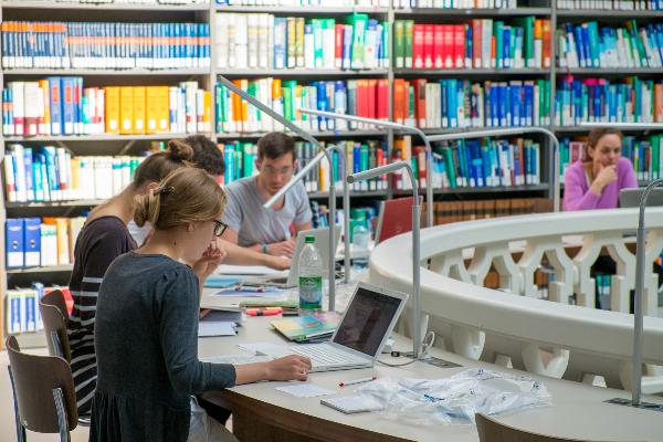 Students studying in the reading hall of the medical library