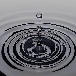 Drop on water surface draws circles