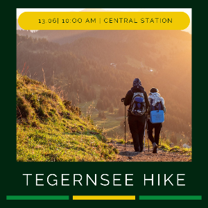 Announcement TutoRIA Tegernsee Hike with picture of two people hiking in the mountains