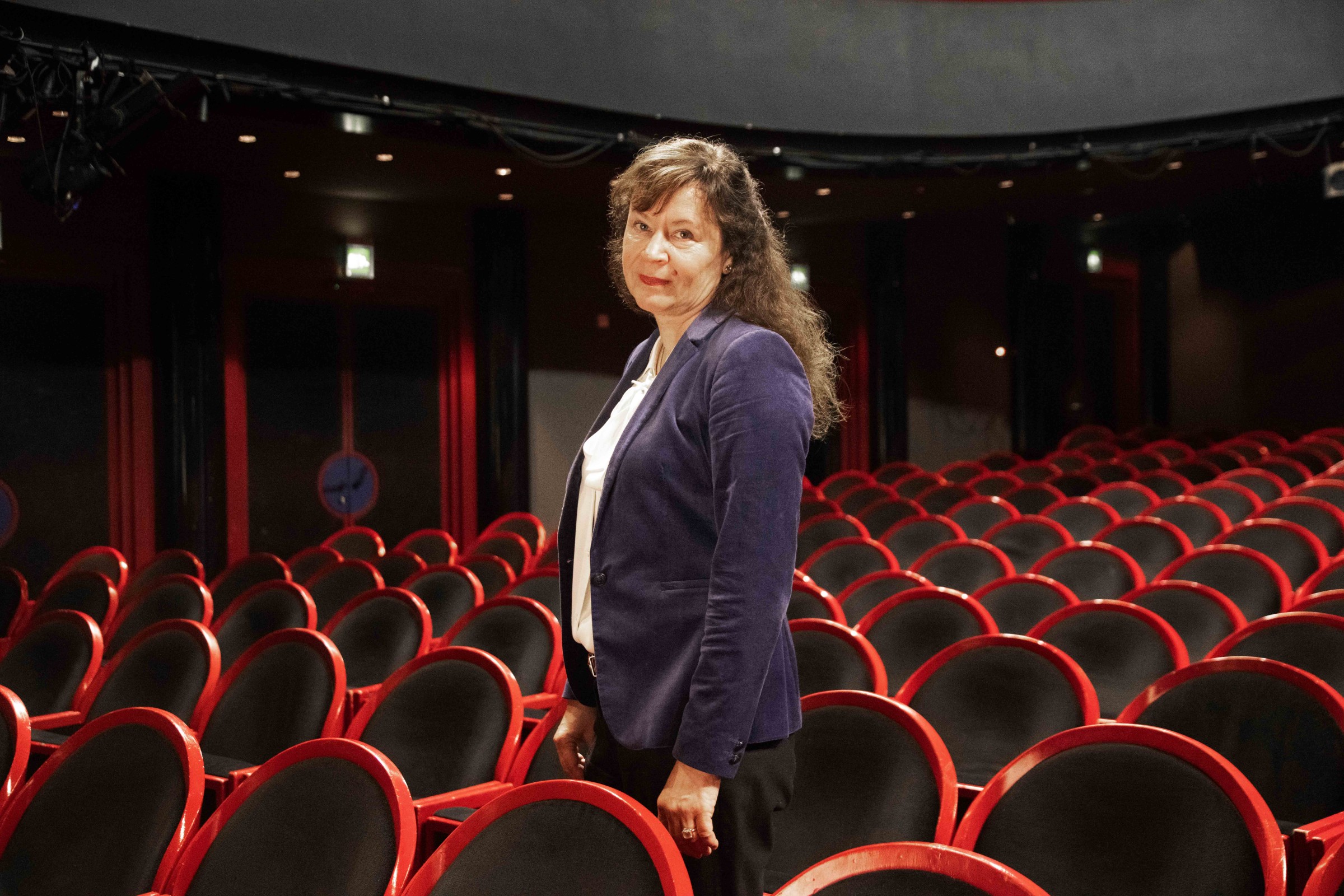 Claudia Olk in the auditorium of the Residenztheater in Munich