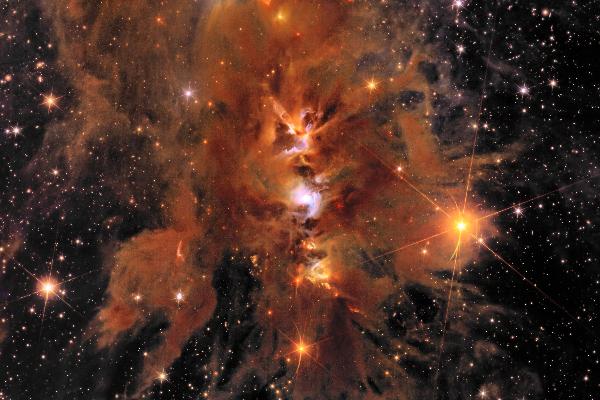Messier 78, a vibrant star nursery enveloped in interstellar dust.