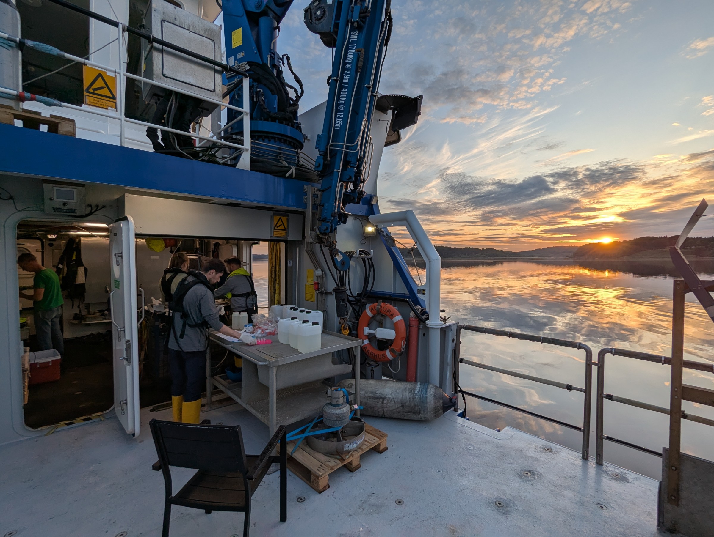 View of the laboratory on board the ship and the sunset over Mariager Fjord
