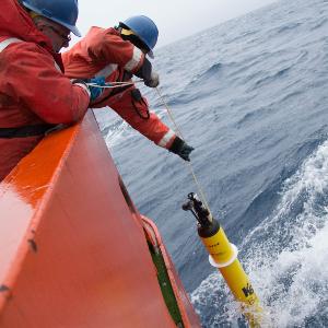 An Argo float is lowered into the water