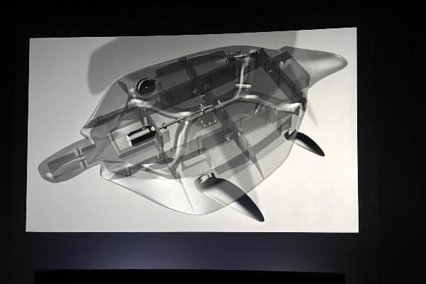 Technical illustration of a turtle-shaped machine with its internal components visible.