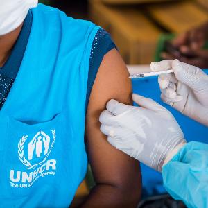 A personnel at United Nations High Commissioner for Refugees (UNHCR) headquarters for refugees from Libya receives their first dose of coronavirus (COVID-19) vaccine at Gashora Emergency Transit Center in Kigali, Rwanda on March 10, 2021.