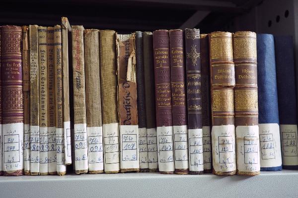 On display are books with signatures, some of which are a little worn.