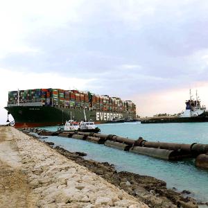 Rescue vessels work at the site of the stuck container ship Ever Given on the Suez Canal, Egypt