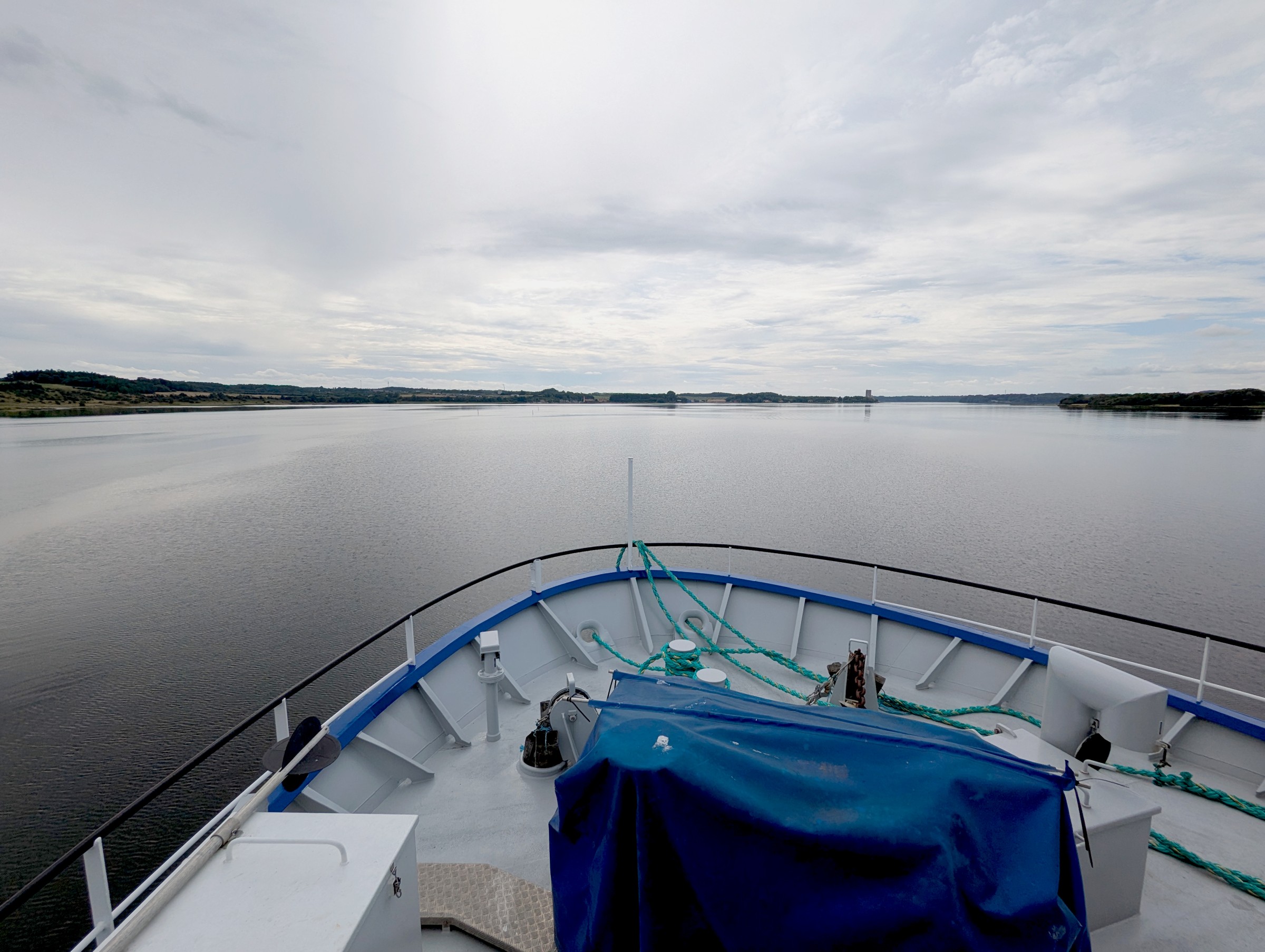 View over the bow of the research vessel Aurora onto Mariager Fjord