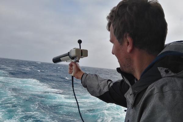 Alexander Haumann with measuring device on the research ship