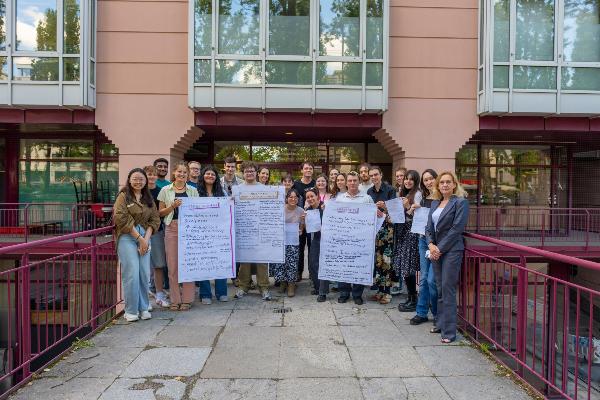Group photo of the team of inclusion tutors in front of an LMU building
