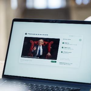 Person viewing a digital archive platform on a laptop displaying a verified video testimony and authenticity records.