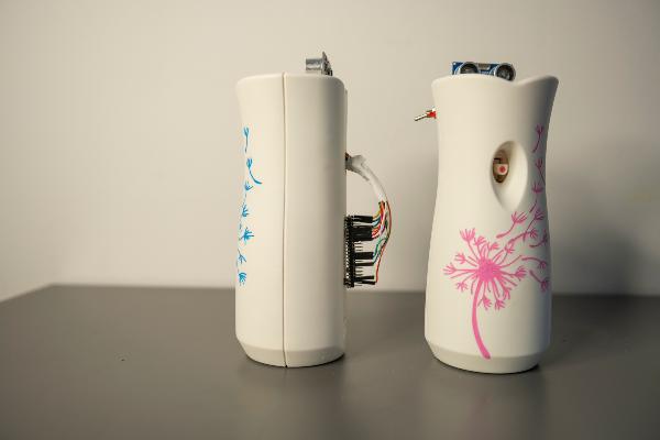 Two fragrance dispensers with sensors