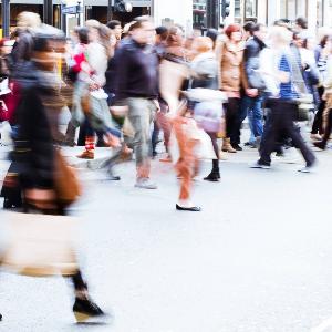 Passers-by walking through a pedestrian zone.