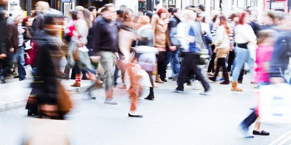 Passers-by walking through a pedestrian zone.