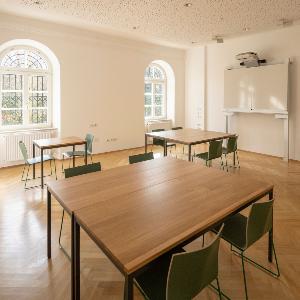 A bright room with group workstations