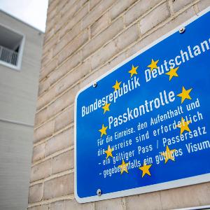 Blue sign for passport control at the German border