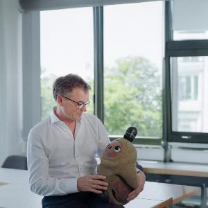 Prof. Dr. Peter Zentel with the robot Marie